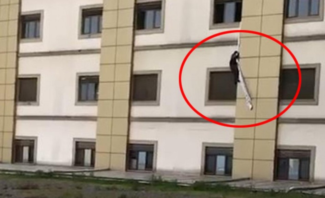 Korona şüphelisi çarşaf sarkıtarak kaçarken 1. katta asılı kaldı