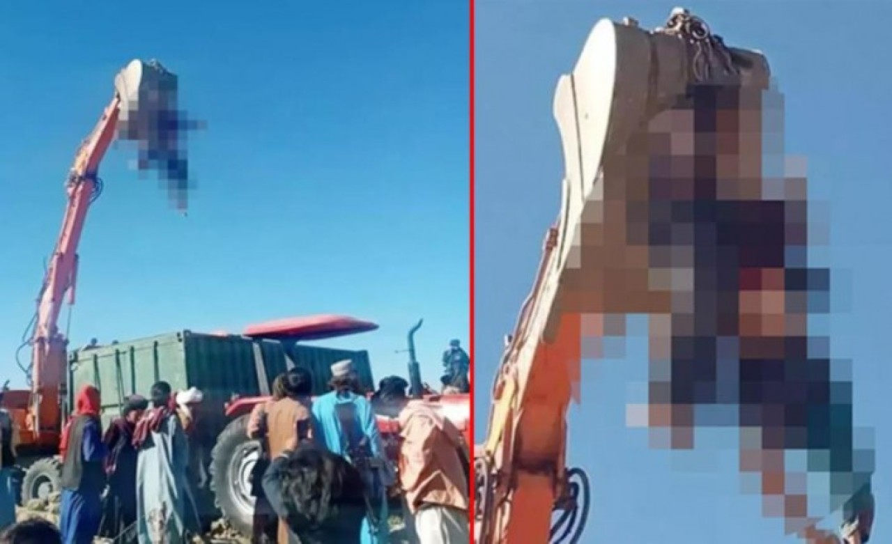 Taliban'dan kan donduran idam! Bu kez de öldürdükleri adamın cesedini kepçeye astılar