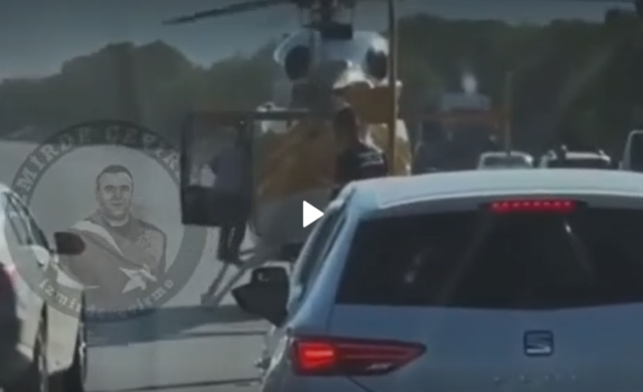 İzmir'de trafiğin ortasına inen gizemli helikopter,  bir kişiyi alıp uzaklaştı