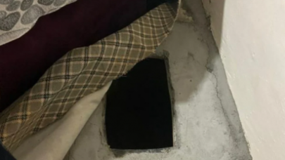 Birçok suçtan aranan şüpheli,  kanepenin altındaki çukurda yakalandı