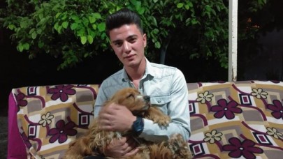 Otomobilin çarptığı köpeğini kalp masajı ile hayata döndürdü