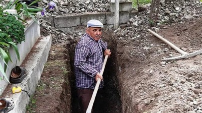 Çocukları telaş yaşamasın diye kendi mezarını kazdı