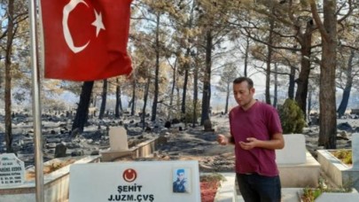 Duygulandıran görüntü: Yangın mezarlığı küle döndürdü,  şehit kabri ve Türk bayrağı yanmadı..