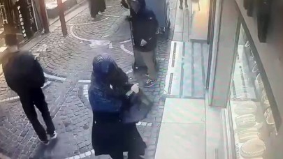 Kadın kılığında binlerce dolar çaldı